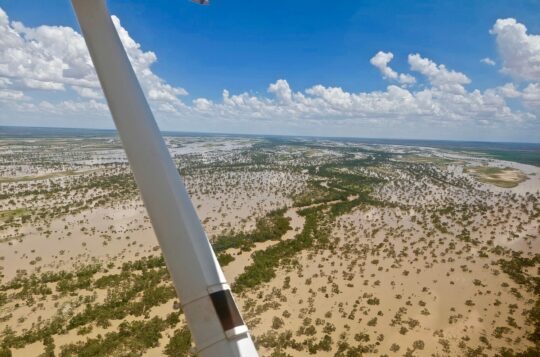 The Georgina river in flood across the flats