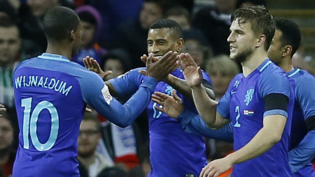Luciano Narsingh (c) celebrates after scoring for the Netherlands against England in a friendly.
