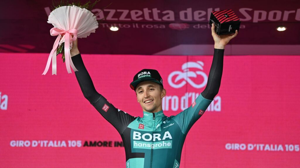 Australia’s Jai Hindley celebrates on the podium after his Giro d’Italia stage win.