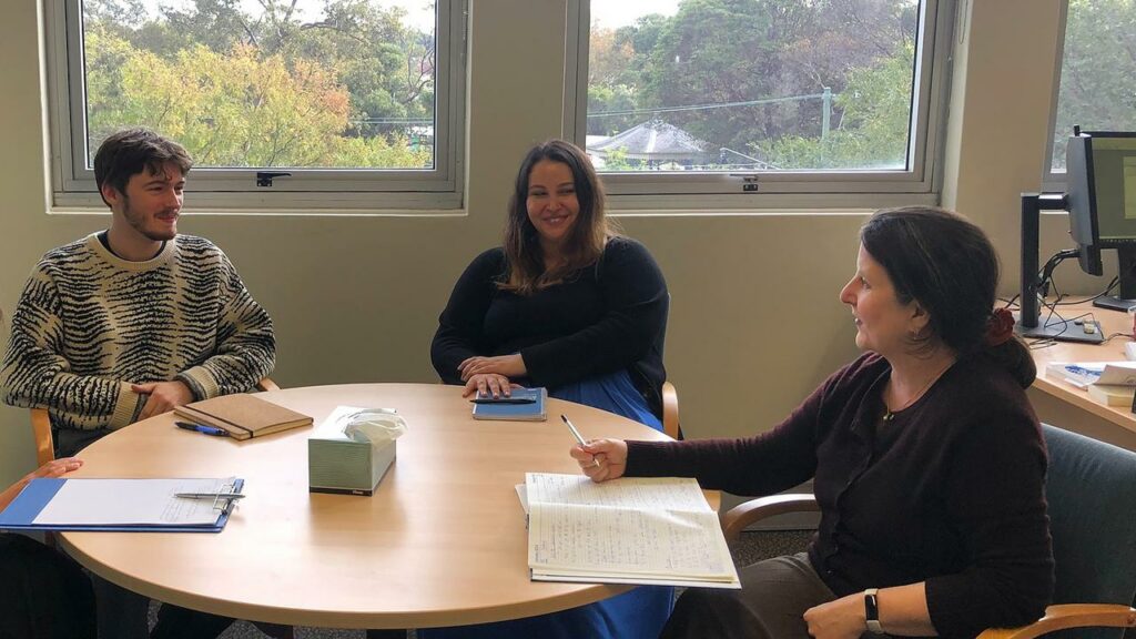 Sydney University professor Caroline Hunt (right), with psychology students, calls for more funding.

