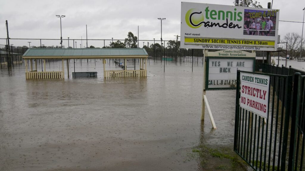 Camden’s tennis courts, due to host school holiday lessons, are under up to six metres of water.
