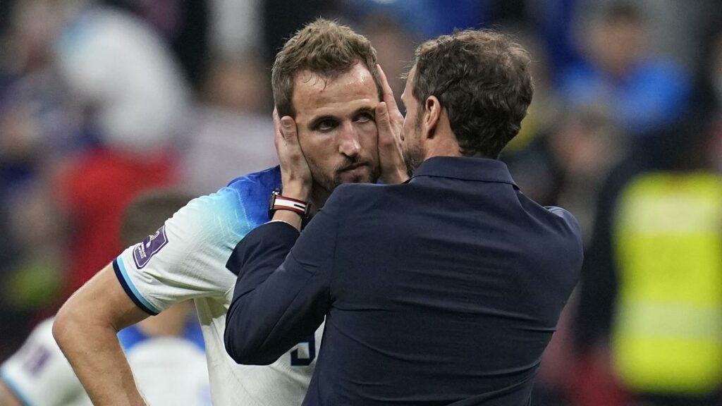 Harry Kane, comforted by coach Gareth Southgate, vows to rebound from his World Cup nightmare.

