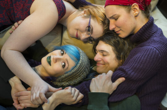 Four people hugging