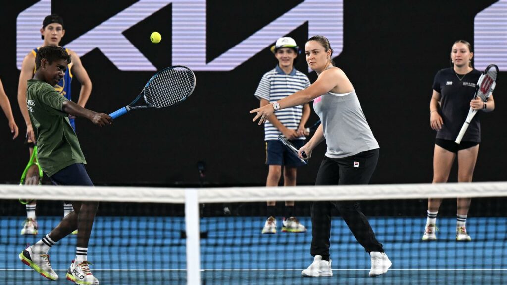 Ash Barty gets back in the swing of things alongside members of the First Nations ballkid squad.