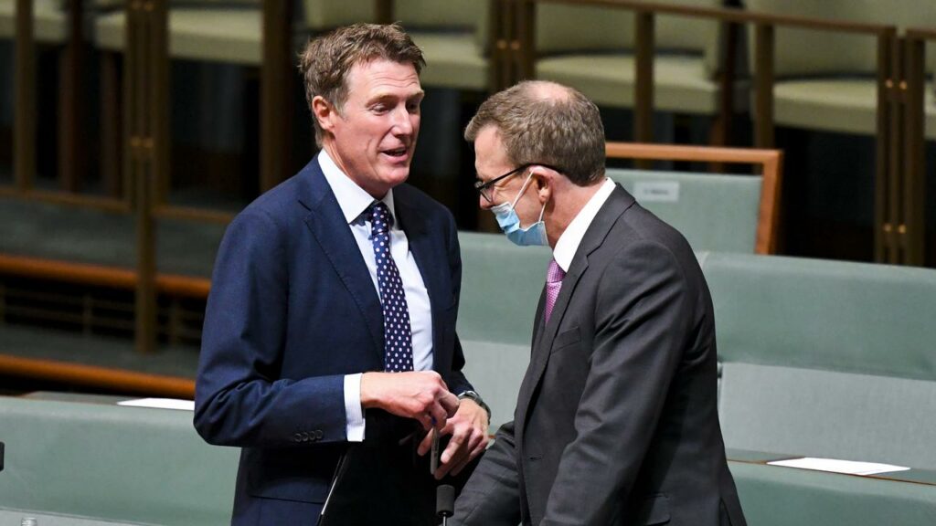 Christian Porter, left, follows Alan Tudge on the witness stand at the robodebt royal commission.
