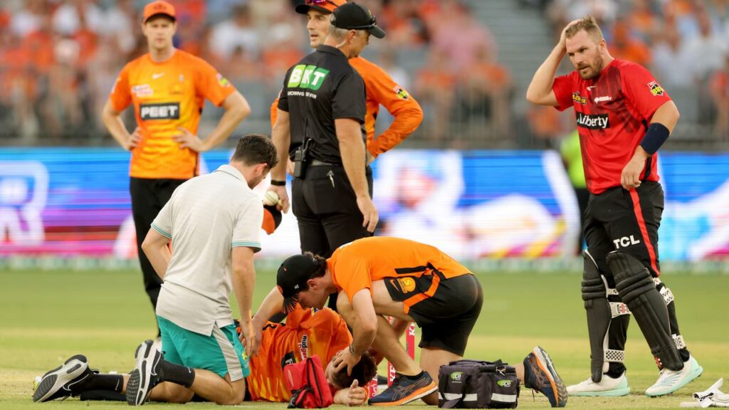 Matt Kelly receives medical attention after being struck in the face against the Renegades.
