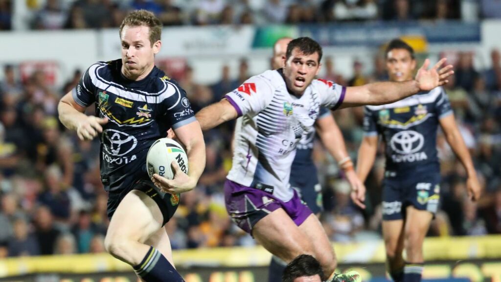 Lachlan Coote breaks clear of the Storm defence while playing for the Cowboys in 2018.
