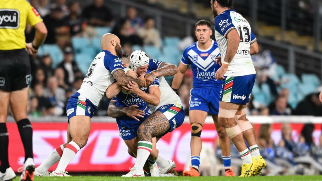 Youngster Blake Wilson of the Bulldogs is tackled to the ground against the Warriors.