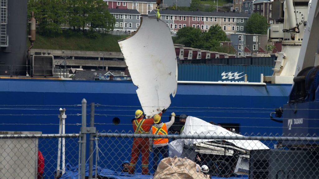 Debris from the Titan submersible, recovered from the ocean floor, has been unloaded in St John’s.