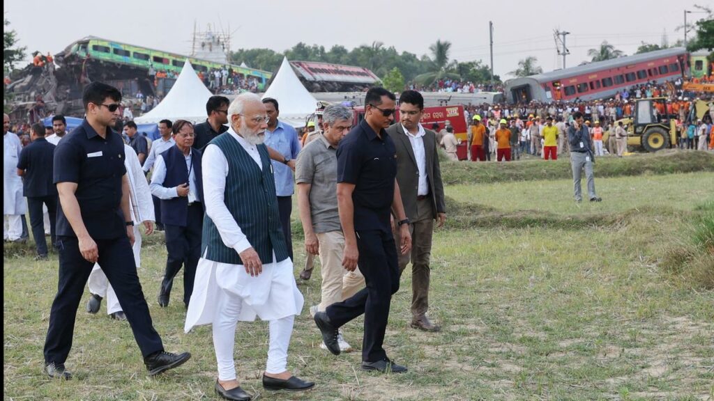 Prime Minister Narendra Modi spoke to rescue workers and inspected the wreckage of a train crash.