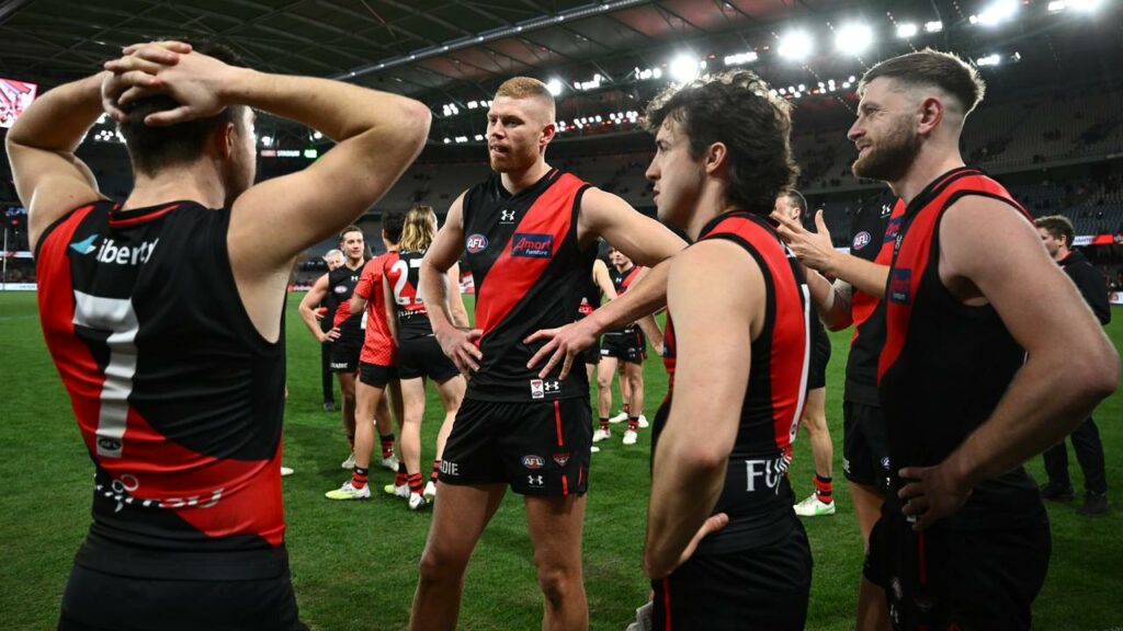 Peter Wright (centre) is one of six Essendon players to miss out for the MCG clash with Collingwood.