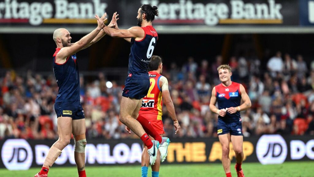 Simon Goodwin says the Dees’ Max Gawn (l) and Brodie Grundy (r) partnership hasn’t been successful.