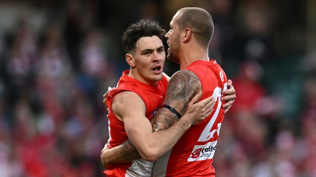 Errol Gulden (l) thrived against GWS in the absence of retired Swans teammate Lance Franklin (r).
