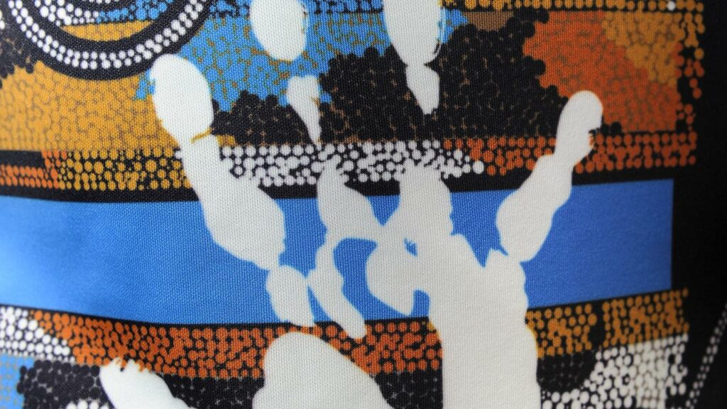 Lionel Morgan’s handprint on an Indigenous All Stars jersey. The league pioneer died on Saturday.