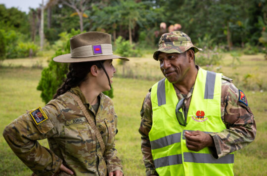 Australian Army officer Captain Helena Sorial from the 3rd Combat Engineer Regiment speaks with Papua New Guinea Defence Force officer Lieutenant Paka during Exercise Puk Puk 2023 on Lombrum Naval Base, Papua New Guinea.