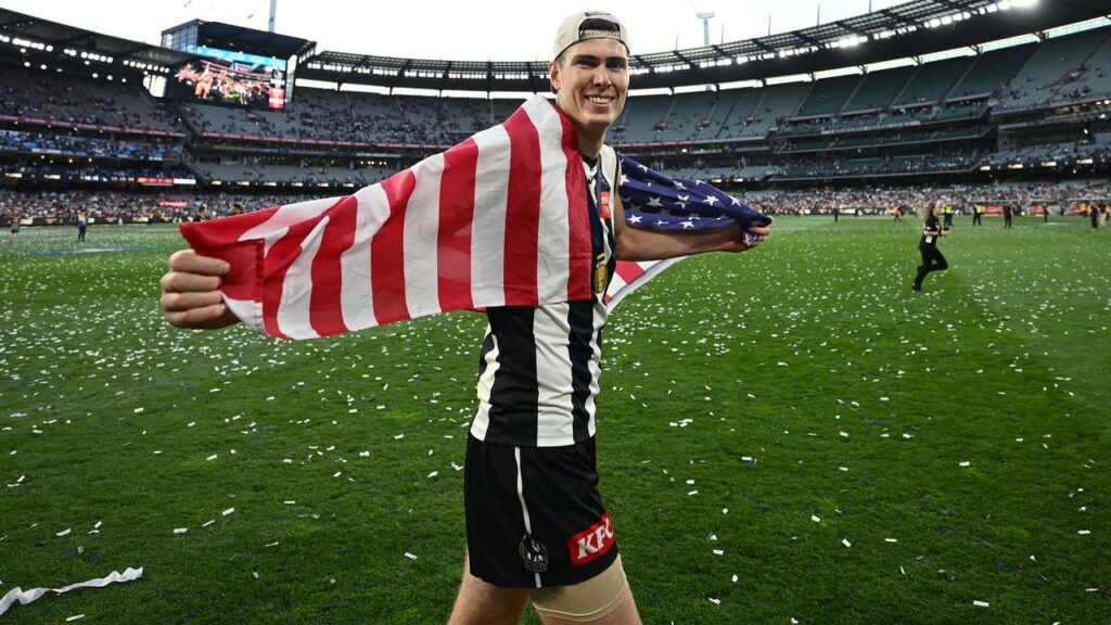 Collingwood’s American ruckman Mason Cox celebrates becoming a premiership player at the MCG.