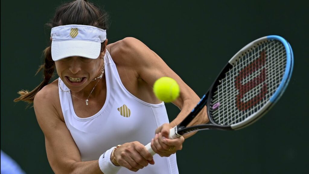 Ajla Tomljanovic returns against Jelena Ostapenko during their bitter meeting at Wimbledon in 2021.