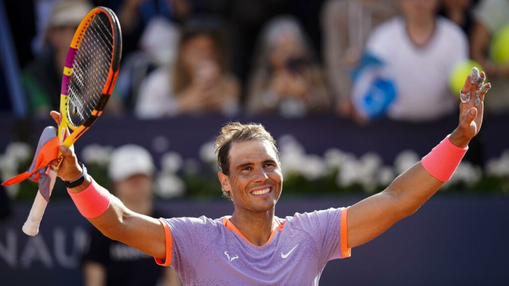 Rafael Nadal celebrates after winning his comeback match having been injured since January.