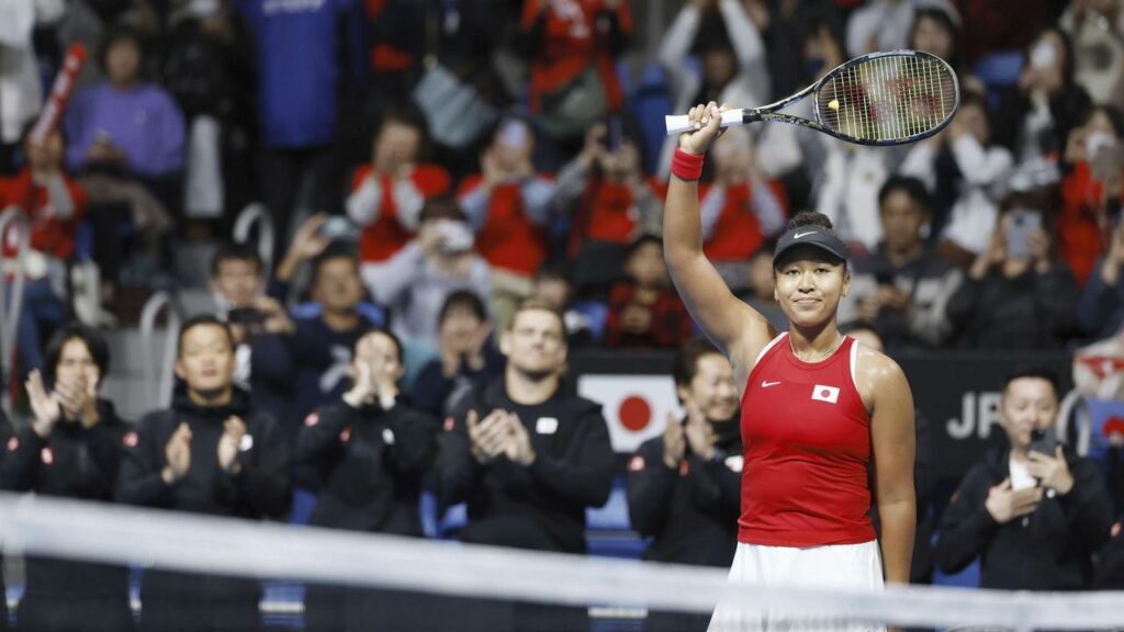 Naomi Osaka salutes the crowd after securing her Billie Jean King Cup singles win for Japan.

