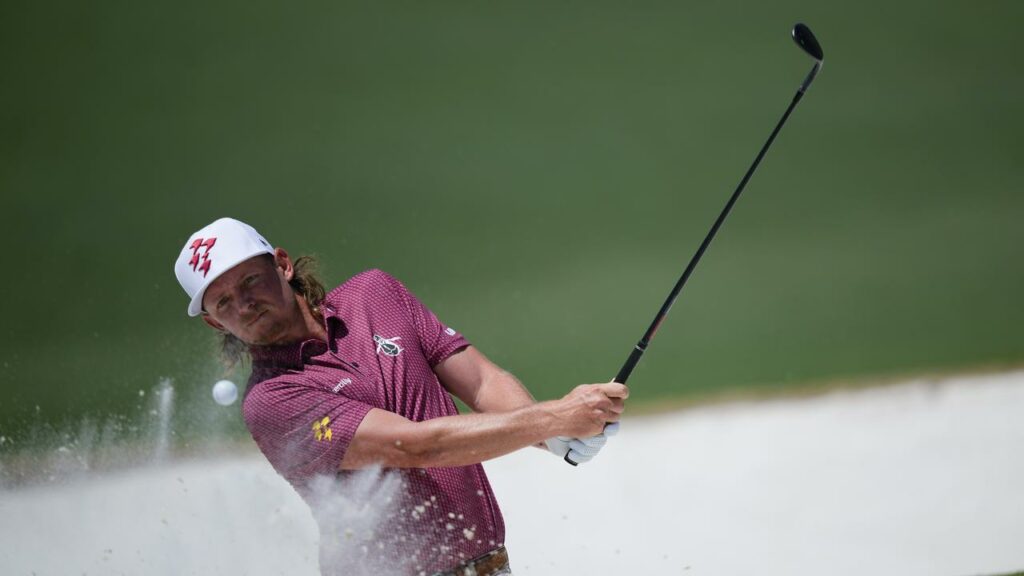 Cameron Smith splashes out of the bunker for a spectacular eagle on the second hole at Augusta.