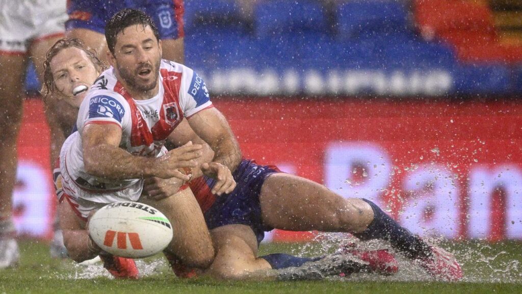 Ben Hunt, here in action on a wet night at Newcastle, says he wants to stay with the Dragons.