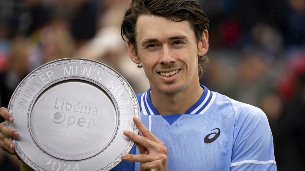 Alex de Minaur poses with the winner’s trophy after his victory over Sebastian Korda in Rosmalen.
