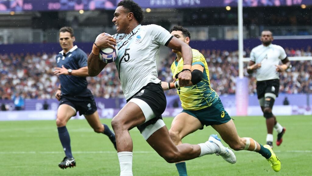 Iosefo Baleiwaikiriki scores one of Fiji’s four tries in the big semi-final win over Australia.