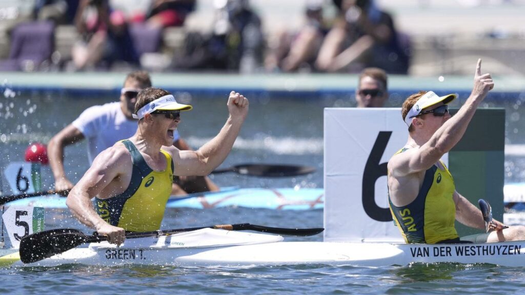 Tom Green and Jean van der Westhuyzen celebrate after winning the kayak double 1,000m in Tokyo.