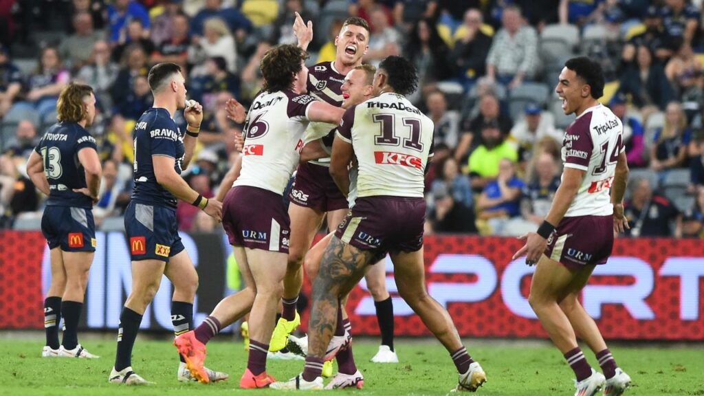 Manly players surround Daly Cherry-Evans after the halfback’s dramatic late match-winner. 
