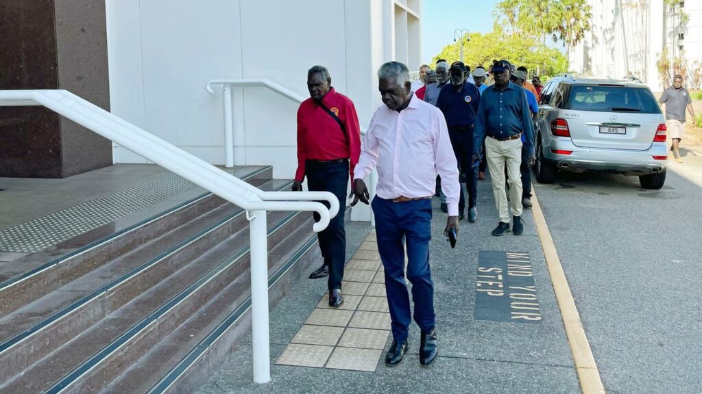Members of the Gumatj Clan arrive for a High Court of Australia hearing in Darwin. 
