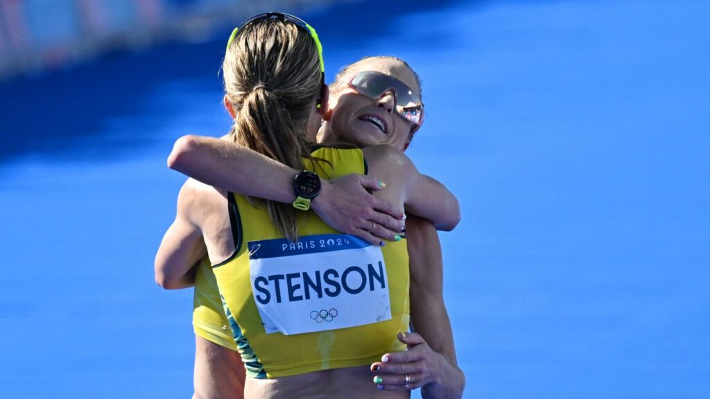 Australians Jess Stenson and Genevieve Gregson embrace after finishing the Olympic marathon.