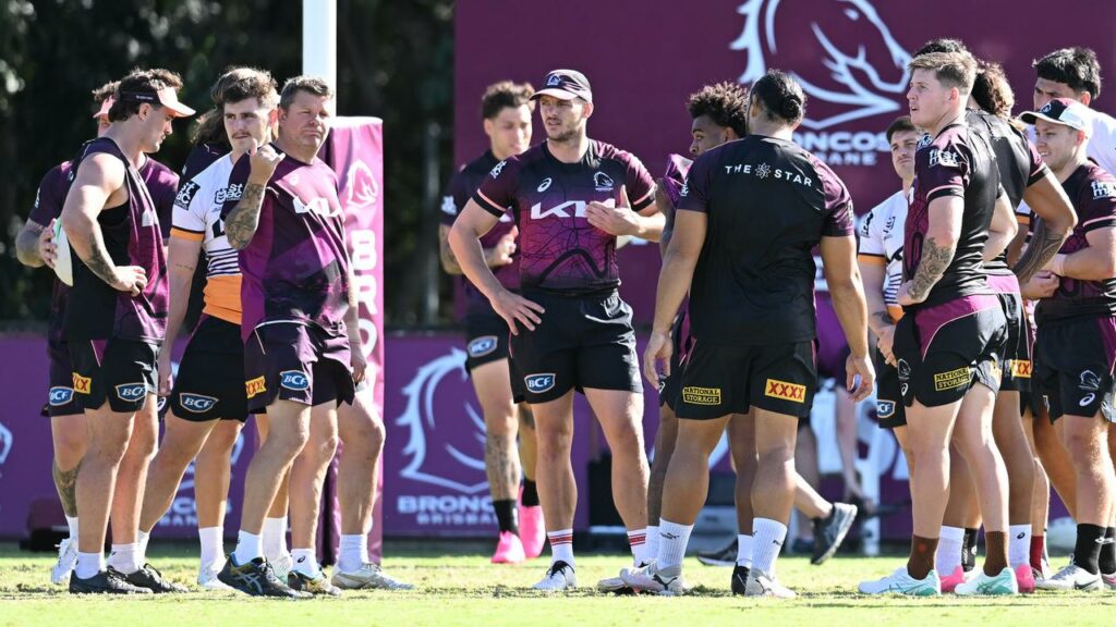 Brisbane assistant Lee Briers (third from left) and the players want a change in training standards.
