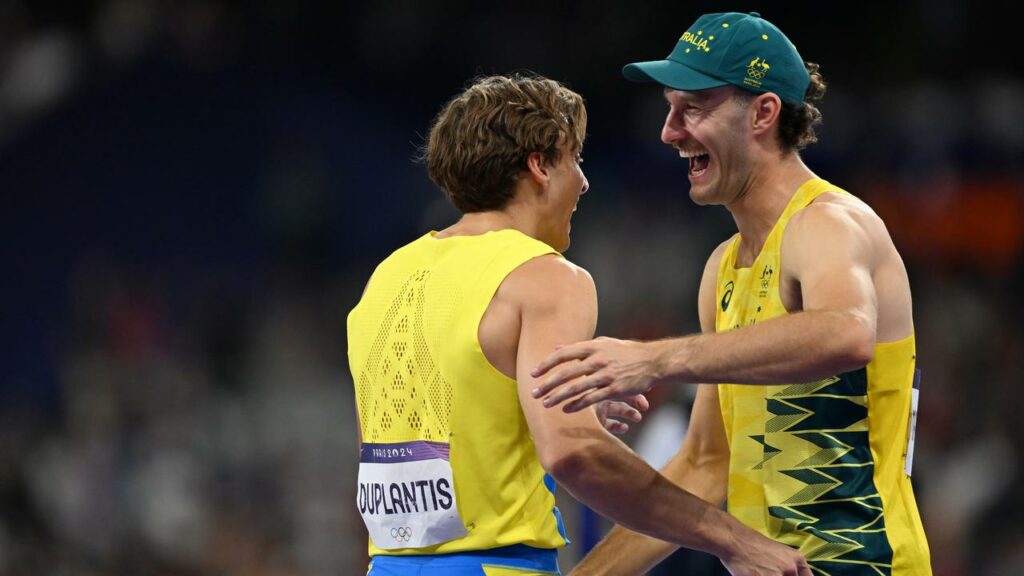 Australian Kurtis Marschall congratulates Armand Duplantis on his world record.