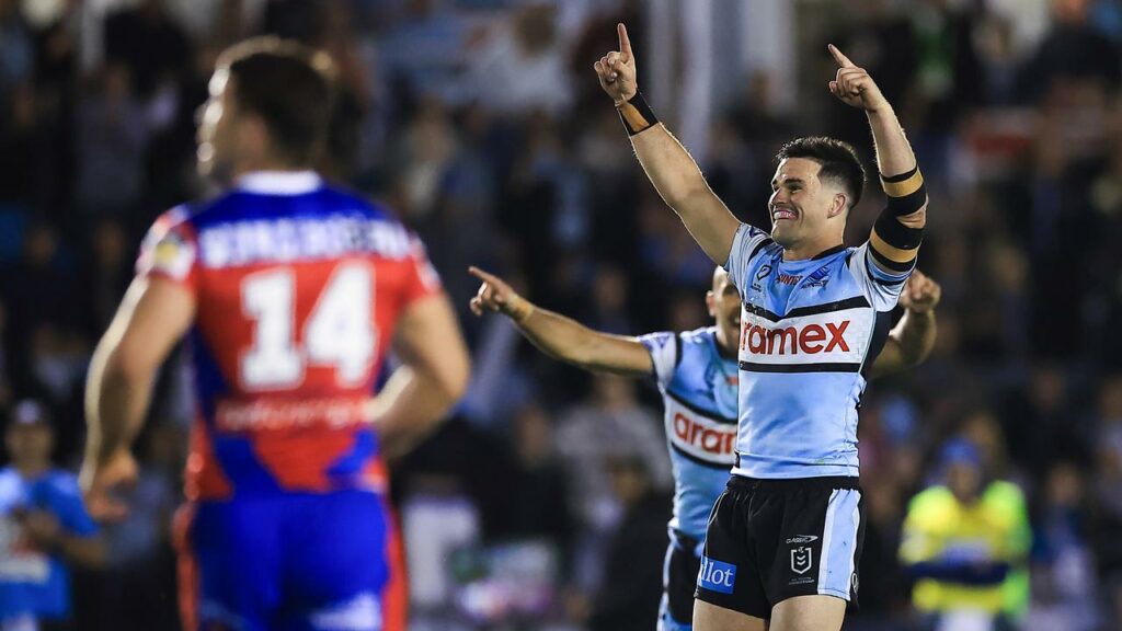 Daniel Atkinson celebrates his match-winning golden point field goal for Cronulla against Newcastle.