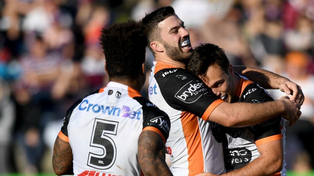 Luke Brooks (r) plans to stop his former housemate James Tedesco (c) when they clash on Saturday.