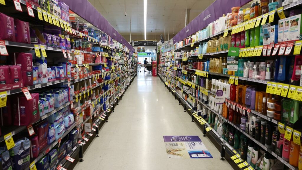 Prices should go down as a result of tougher merger laws for supermarket giants.