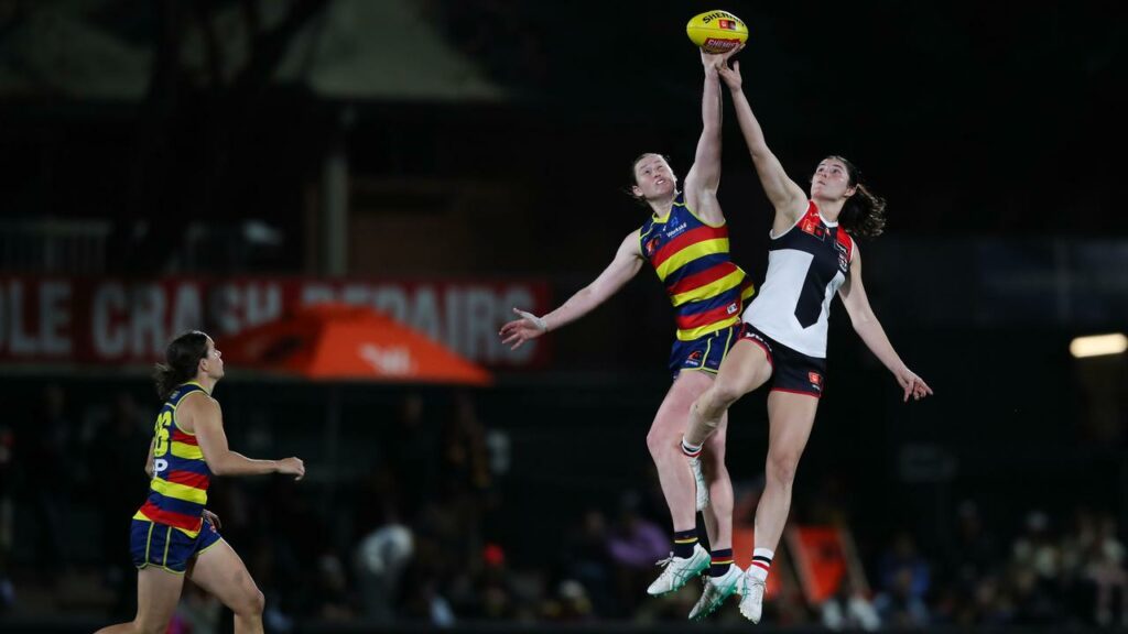 The Crows’ Jessica Allan and Saints’ Emmelie Fielder in an aerial battle in a tight AFLW tussle.