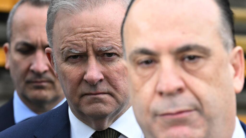 ARLC chair Peter V’landys (r) and PM Anthony Albanese (c) are set to grant PNG its NRL wish.
