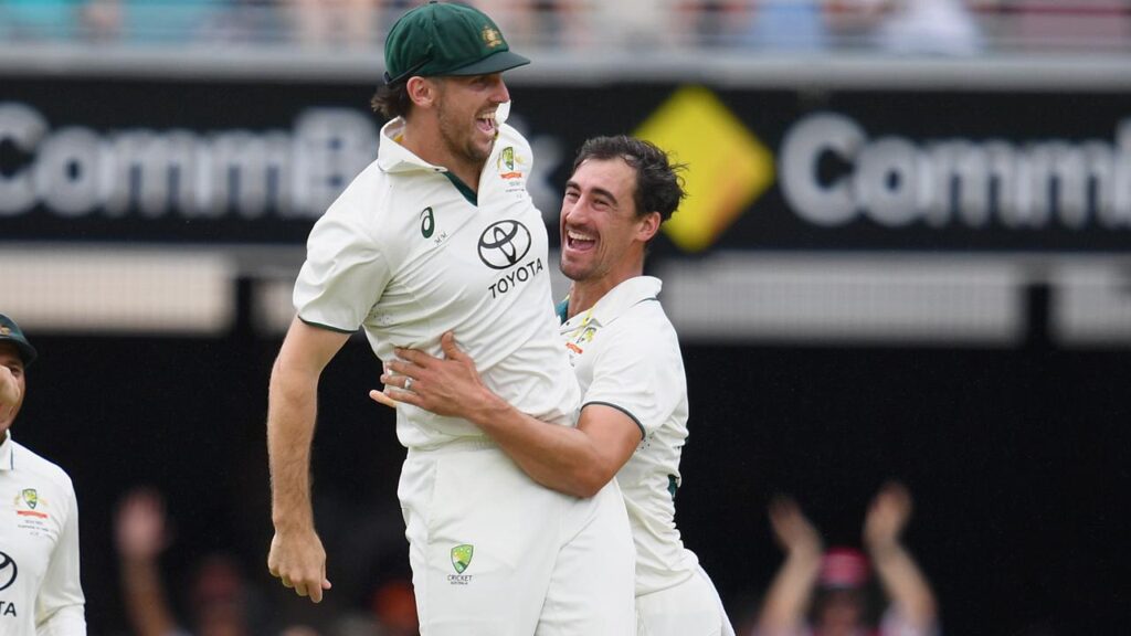 Mitchell Starc (right) rocked India and was backed up in the field by Mitch Marsh (left).