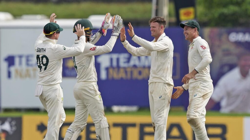 Steve Smith (left) celebrates with his teammates after their first-Test win in Sri Lanka.
