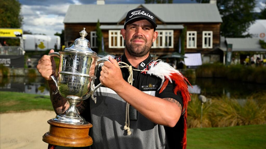 Ryan Peake looks right at home with the NZ Open trophy in his keeping.
