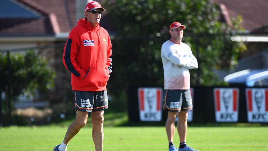 Wayne Bennett (L) has left the Dolphins and new coach Kristian Woolf (R) is tipped to defy history.