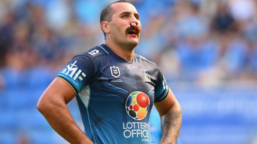 Gold Coast prop Reagan Campbell-Gillard catches his breath after his nose was broken and bloodied.