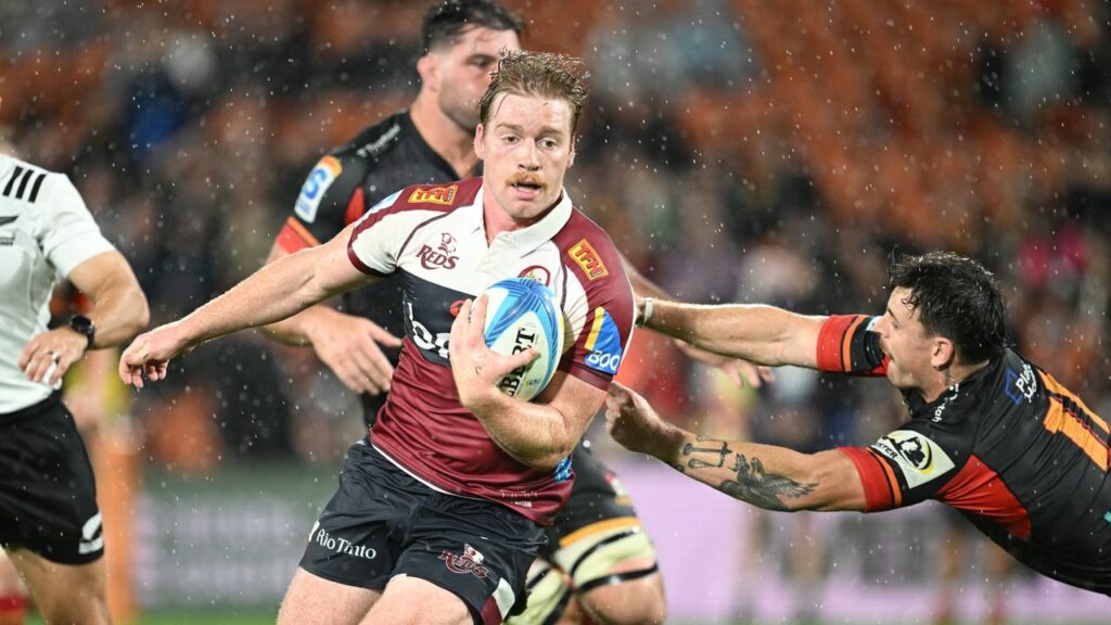 Harry McLaughlin-Phillips attacks for the Reds in their rain-soaked loss to Chiefs.
