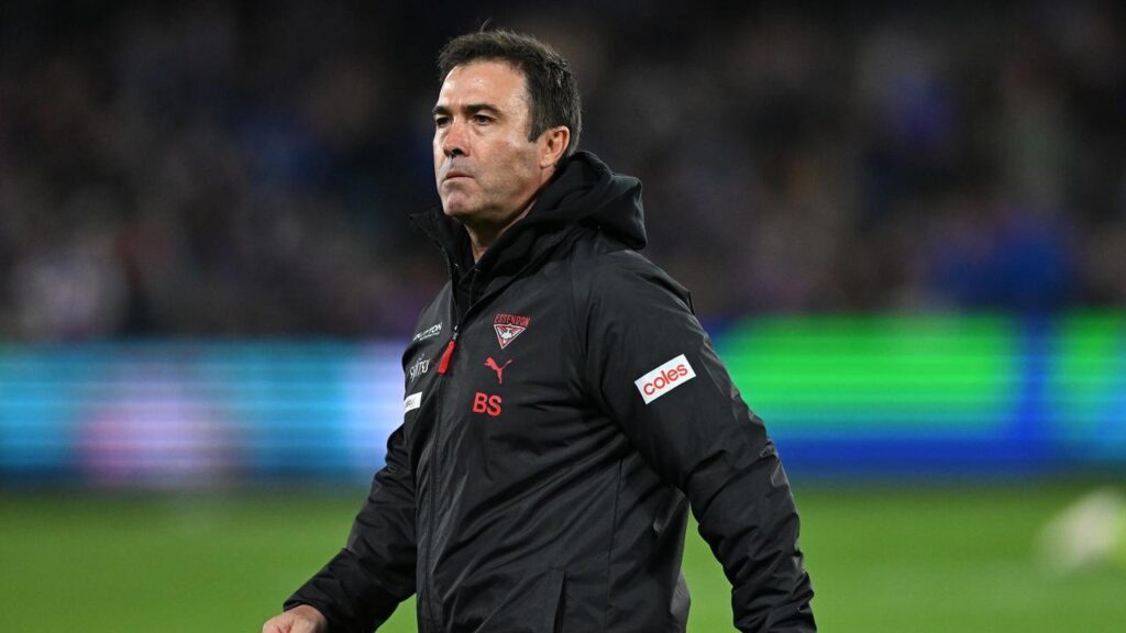 Bombers coach Brad Scott (pic) isn’t feeling any added pressure amid talk of a James Hird return.