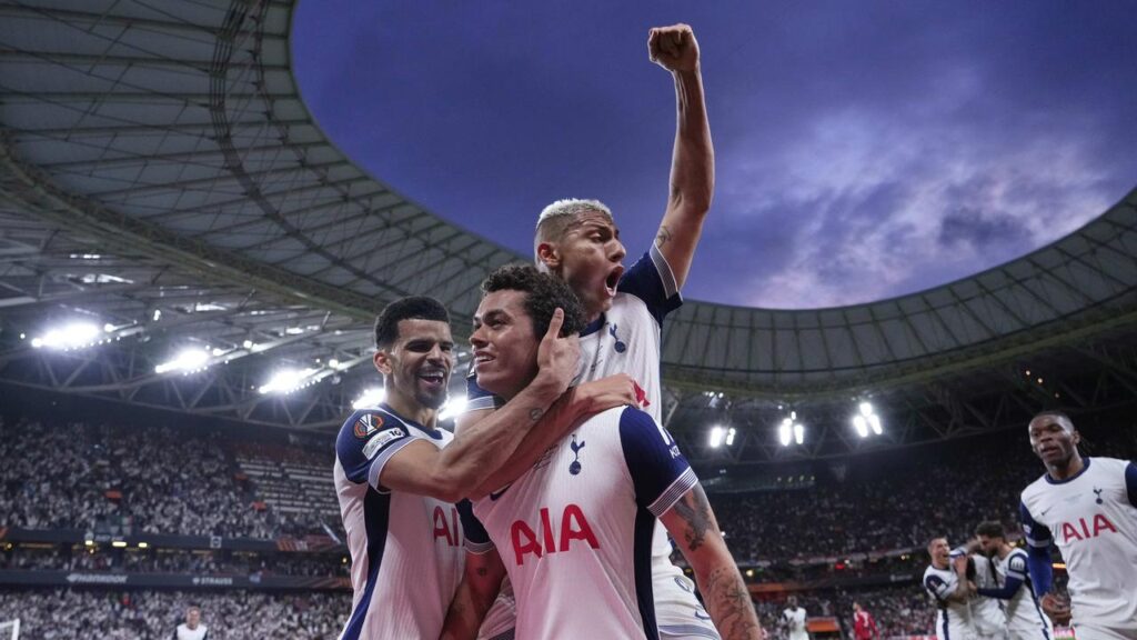 Brennan Johnson (C) gets hugged after the goal that won Ange Postecoglou’s Spurs the Europa League.