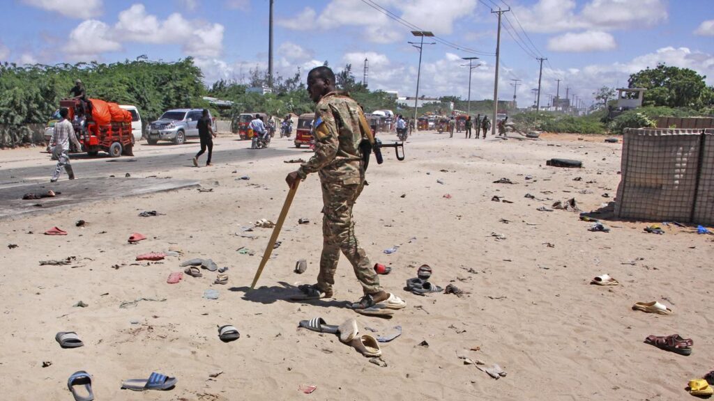 Family members searched for loved ones’ shoes after a Somalia suicide bombing.