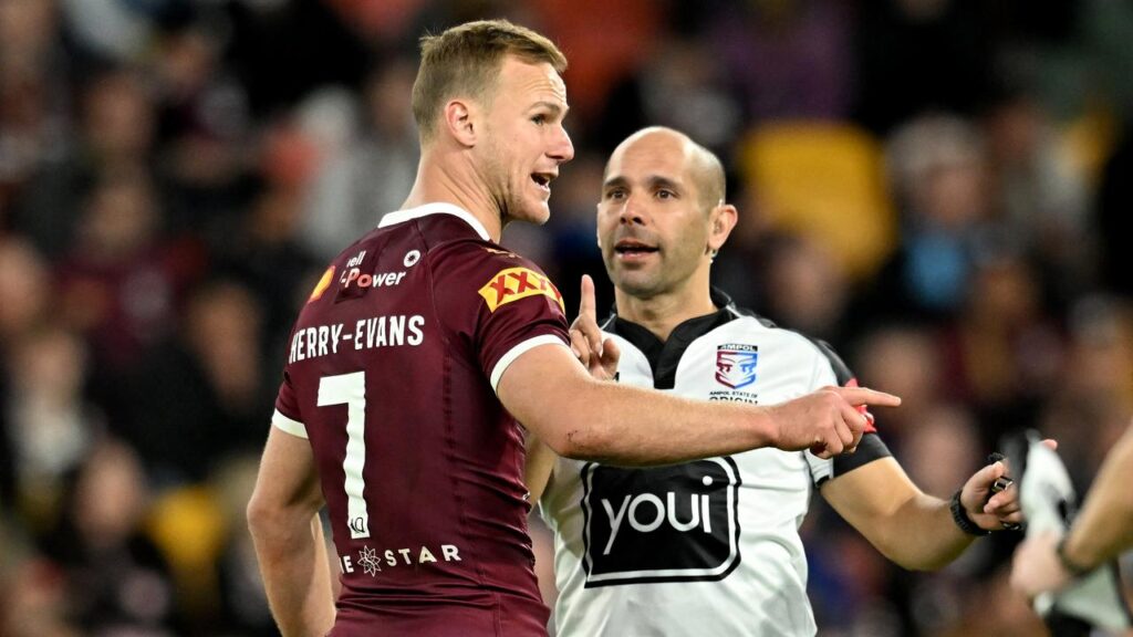 Queensland captain Daly Cherry-Evans and referee Ashley Klein during the 2022 Origin series.
