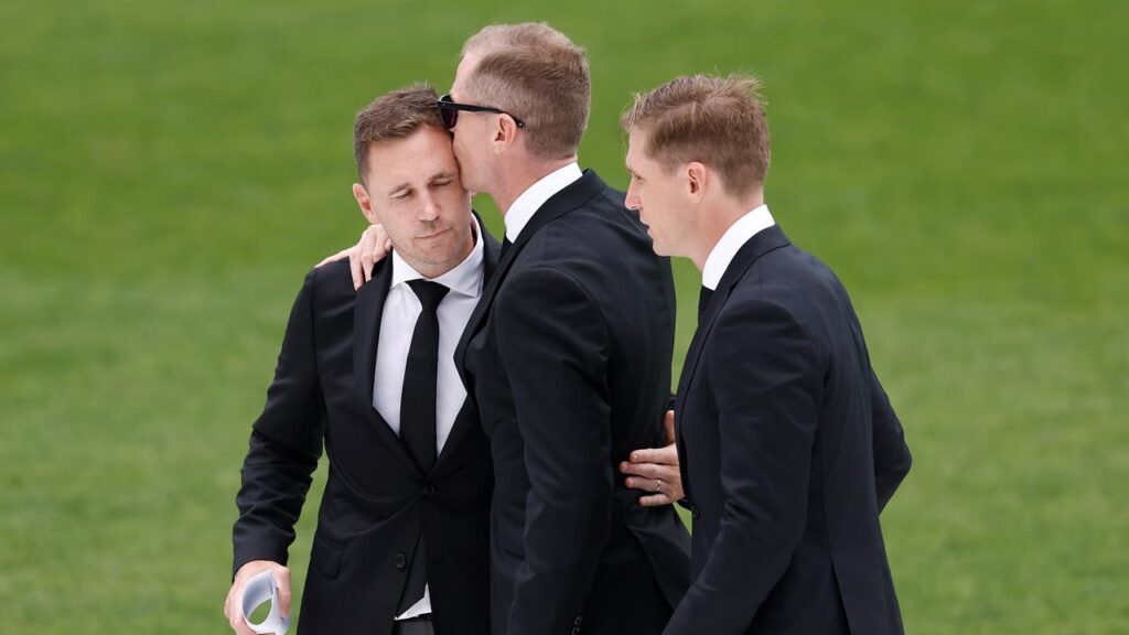 Adam Selwood (centre) with his brothers Joel and Scott at Troy Selwood’s funeral in March.