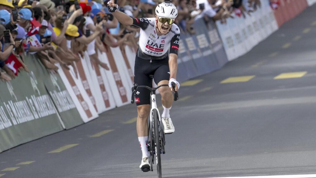Australian rider Jay Vine roars with delight after winning the third stage of the Tour de Romandie.